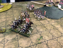 La cavalerie Polonaise charge l'ennemi Prussien, appuyée par des unités d'infanterie et une batterie.
