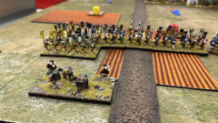 Le camp Samouraï, protégé par des archers en position dans un champ.
