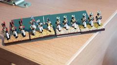 Nicolas - 4 phases de soclage sur infanterie polonaise  (application gel texturé sable jaune, brossage ocre, brossage léger crème, flocage).
